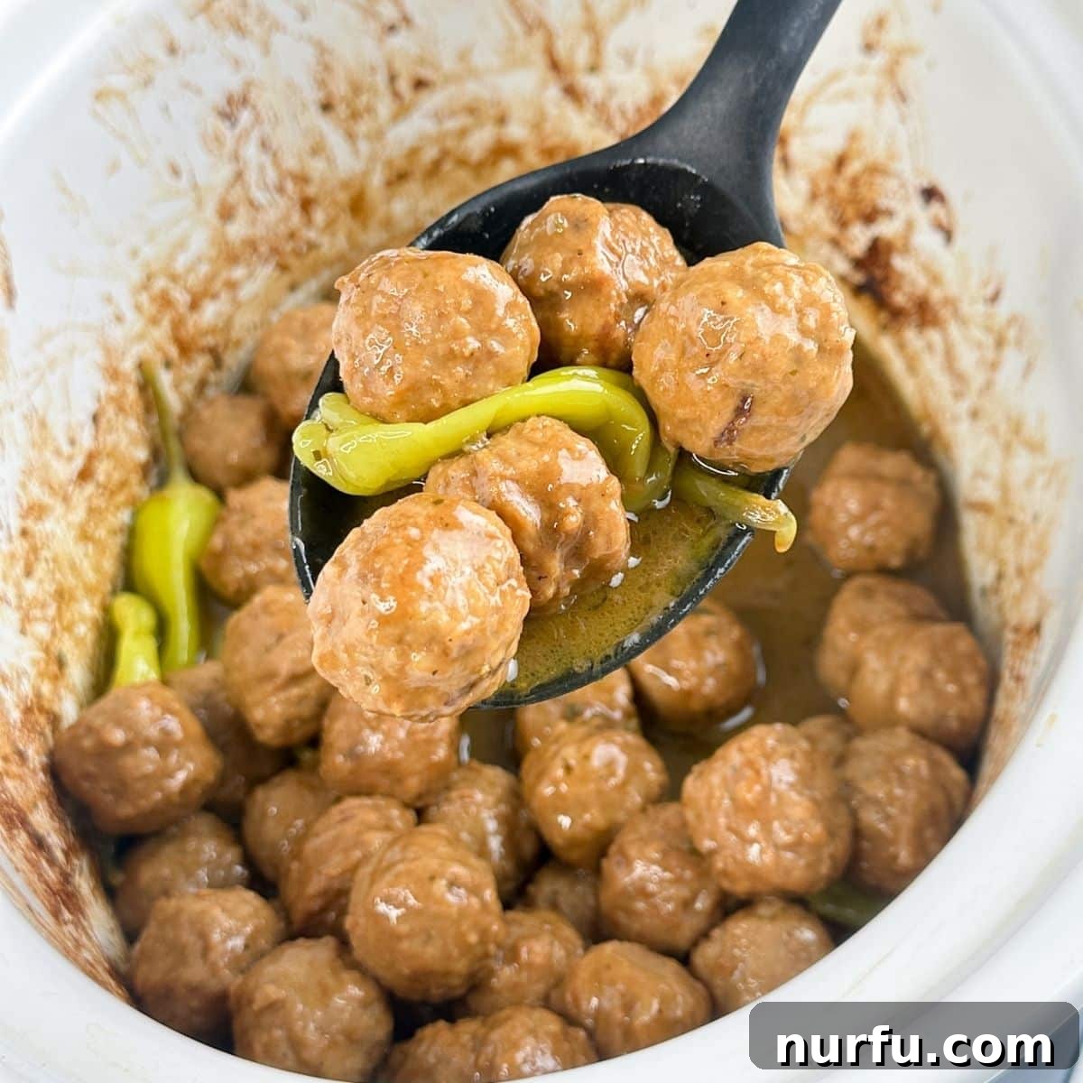 Classic Mississippi Meatballs with Tangy Pepperoncini Sauce 6 Spoon with Mississippi meatballs.