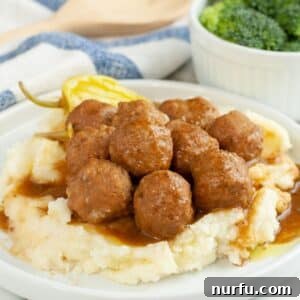 Classic Mississippi Meatballs with Tangy Pepperoncini Sauce 7 Plate of meatballs over mashed potatoes.