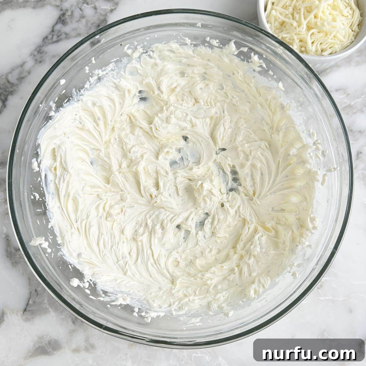 Bowl of whipped cream cheese.